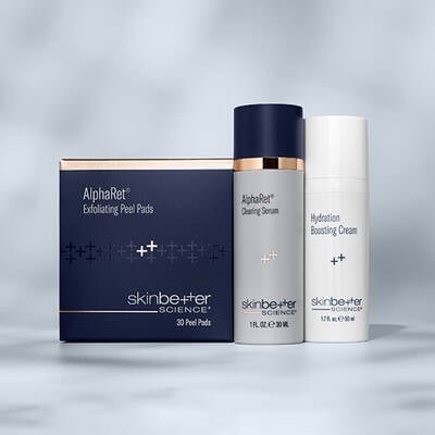 Three skinbetter science products lined up horizontally on a pale grey surface
