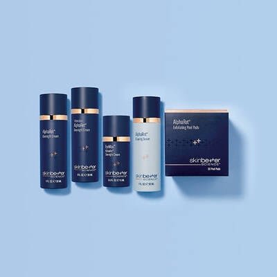 Three skinbetter science products lined up horizontally on a pale grey surface